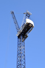 Tower Crane seen from below against Blue Sky 