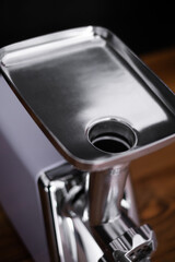household electric meat grinder on a light gray background, different perspective positions. kitchen appliances. top view