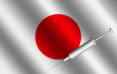 A covid-19 vaccine syringe on the Japanese flag