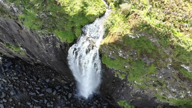 Aerial footage of Kilt Rock & Mealt Falls Viewpoint beyond the Scottish highlands in the Isle of Skye near Portree.