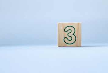 numbers on wooden cubes on a white background.
