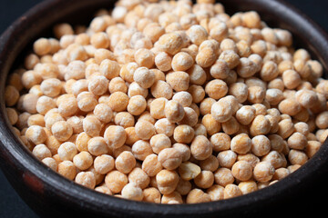 raw chickpeas in clay dish