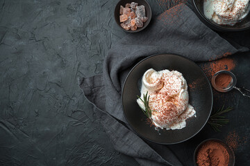 Delicious ice cream on a brutal dark background. Top view, horizontal, with space to copy. The concept of the desserts.