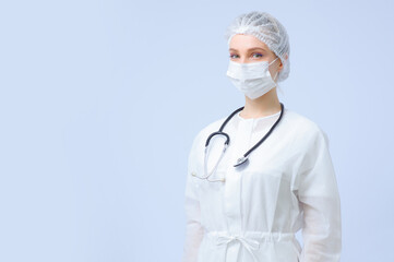 Portrait of a female doctor or nurse wearing medical cap and face mask