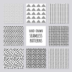 Set of hand-drawn seamless black and white patterns. Vector simple modern grunge repeat backgrounds.