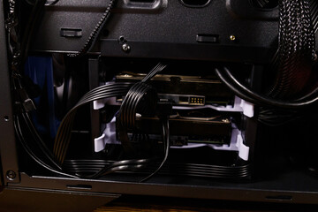 Close-up of new computer system unit with installed hard drives. Desktop PC from the inside