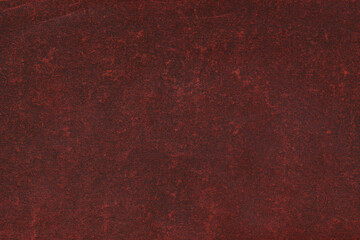 Fototapeta premium Cardboard red abstract pattern texture close-up. Retro old paper background. Grunge concrete wall. Vintage blank wallpaper.