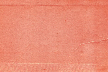 Cardboard red abstract pattern texture close-up. Retro old paper background. Grunge concrete wall. Vintage blank wallpaper.