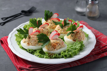 Stuffed eggs with crab sticks and cheese, a delicious festive snack. Closeup.