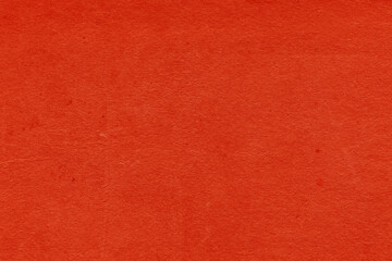 Cardboard red abstract pattern texture close-up. Retro old paper background. Grunge concrete wall. Vintage blank wallpaper.