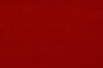 Fototapeta premium Cardboard red abstract pattern texture close-up. Retro old paper background. Grunge concrete wall. Vintage blank wallpaper.