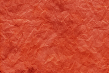 Fototapeta premium Cardboard red abstract pattern texture close-up. Retro old paper background. Grunge concrete wall. Vintage blank wallpaper.