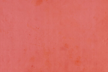 Cardboard red abstract pattern texture close-up. Retro old paper background. Grunge concrete wall. Vintage blank wallpaper.