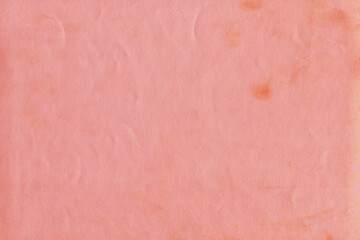 Cardboard red abstract pattern texture close-up. Retro old paper background. Grunge concrete wall. Vintage blank wallpaper.