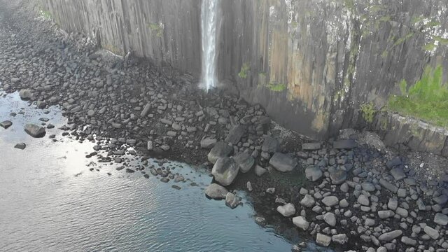 Aerial footage of Kilt Rock & Mealt Falls Viewpoint beyond the Scottish highlands in the Isle of Skye near Portree.