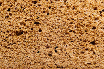 The texture of the bread on the cut close-up. Rye bread in the cut. Bread