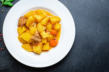 stewed potatoes and meat roast vegetables goulash portion on the table for healthy meal snack outdoor top view copy space for text food background rustic image
