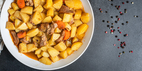 stewed potatoes and meat roast vegetables goulash portion on the table for healthy meal snack...