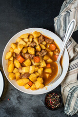 stewed potatoes and meat roast vegetables goulash portion on the table for healthy meal snack outdoor top view copy space for text food background rustic image