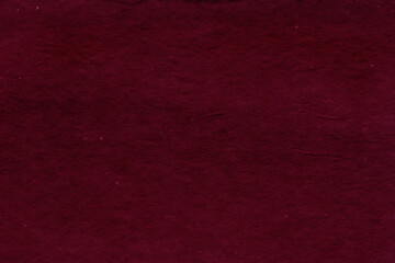 Cardboard red abstract pattern texture close-up. Retro old paper background. Grunge concrete wall. Vintage blank wallpaper.