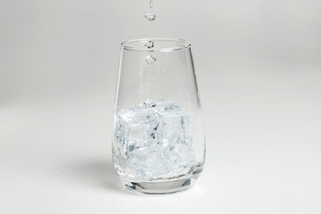 Glass of mineral carbonated water with ice