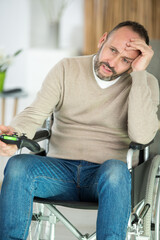 mature disabled man frustrated by computer game