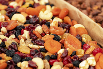 Dried fruit background. Rows of dried dates, apricots,cranberries, blueberries, prunes.
