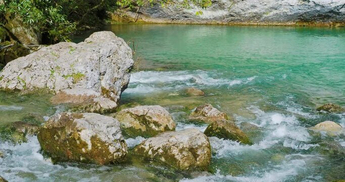 Blue lake of karst origin on right bank of Bzyb River. Landmark in Abkhazia.