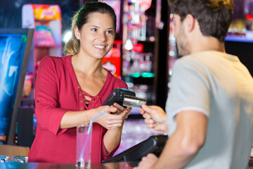 man paying with contactless credit card