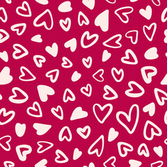 Random placed vector hearts seamless pattern with pink background.