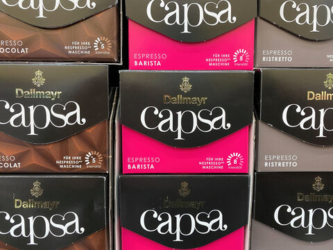 Viersen, Germany - February 3. 2021: View on carton boxes Dallmayr capsa coffee capsules  in shelf of german supermarket