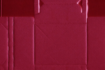 Cardboard red abstract pattern texture close-up. Retro old paper background. Grunge concrete wall. Vintage blank wallpaper.