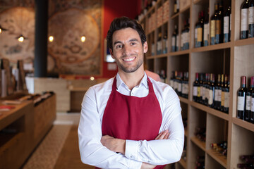Obraz premium portrait of handsome sommelier in cellar