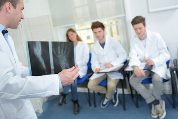 Fototapeta na wymiar student and teacher in medical class - xray results