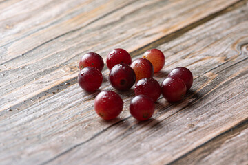 Red grapes on a wooden stand
