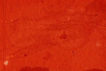 Cardboard red abstract pattern texture close-up. Retro old paper background. Grunge concrete wall. Vintage blank wallpaper.