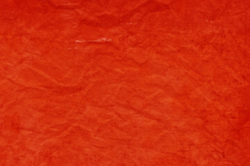Fototapeta premium Cardboard red abstract pattern texture close-up. Retro old paper background. Grunge concrete wall. Vintage blank wallpaper.
