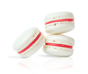 Three white french macarons
isolated on white background.