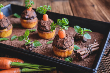 Sweet carrot muffins topped with coconut and chocolate cream