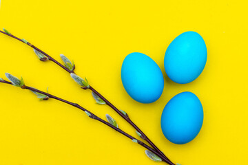 Painted eggs on a yellow background. Chicken eggs on a yellow background. Chicken eggs are colored. Easter. Orthodox holiday. An article about Easter. Article about eggs benefits and harms. Copy space