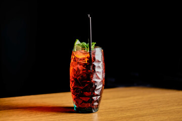 Summer drinks with ice, fresh berries, lemon and berries