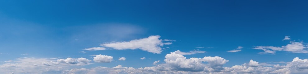Fuffy clouds in blue sky. Summer good weather skyscape high resolution background.