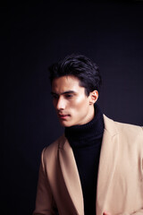 handsome asian fashion looking man posing in studio on black background, lifestyle modern people concept