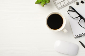 Workspace of serious professional worker concept. Above overhead close up view eyewear with spiral keyboard mouse cup of beverage isolated white wooden backdrop