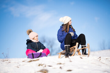family having fun on the snow