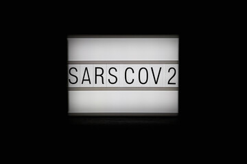 Illuminated text on a dark background.