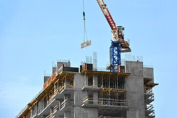 Crane and highrise construction site