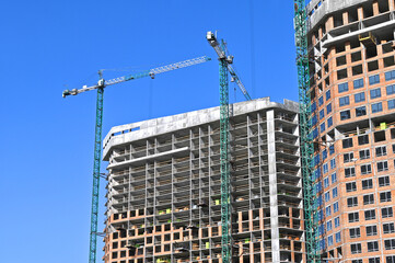 Crane and highrise construction site
