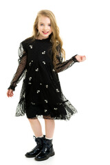 Fototapeta premium Little girl in an elegant dress.The concept of a happy childhood