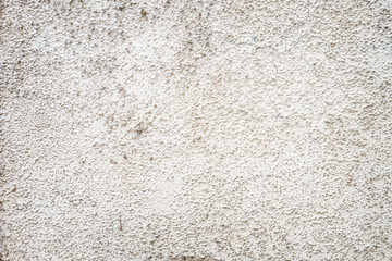 Grey uneven rough cement or concrete background